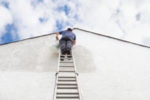 Man painting house